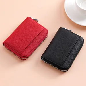 Genuine leather mini zipper coin purse and card holder for women, compact and multi-functional.