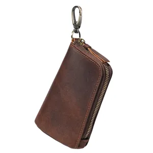 Porte-cles en cuir vintage avec fermeture eclair et crochet metallique pour hommes marron.
