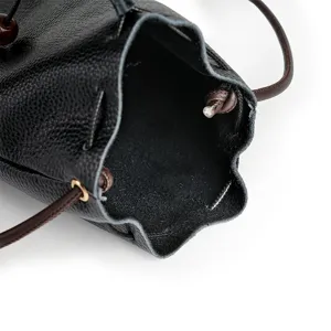 Black genuine leather drawstring lucky bag, compact crossbody purse, stylish small bucket bag.