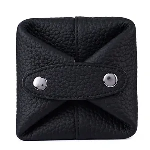 Compact genuine leather coin purse and mini earphone storage bag with secure metal snap buttons.