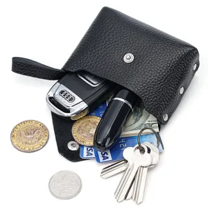 Black leather mini coin purse with snap closure, portable compact wallet for cards and keys.