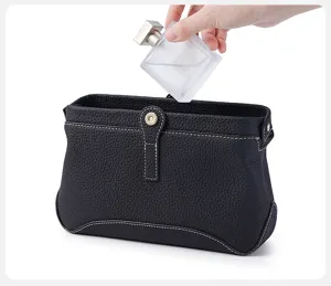 Premium black genuine leather cosmetic bag, large capacity toiletry organizer pouch.
