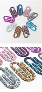 Detailed close-up view of shimmering glitter finish and thick texture on colorful large acrylic paperclips.