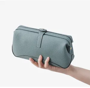 Large genuine leather toiletry bag for men and women, stylish pebble grain cosmetic pouch.