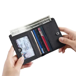 Klassische schwarze Leder Geldbörse Kartenetui mit Druckknopf, Fächern für Karten und Bargeld.