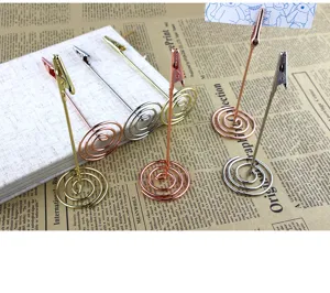 Metal wire memo clip detail shot, vertical desktop card holder and spiral base design.