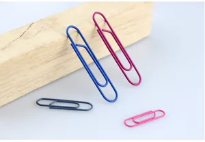 Colorful metal paper clips detail shot, showcasing various sizes and vibrant shades for office.