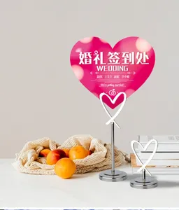 Stainless steel heart place card holder detail view for wedding table decor and memo display.