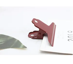 Large metal binder clip in red, heavy duty stationery paper clamp for office and art use.