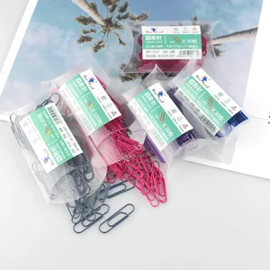 Colored metal paper clips set in clear pillow boxes, assorted sizes for office organization.