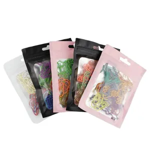 Creative colorful shaped metal paper clips in multi-colored pouches for office and school.