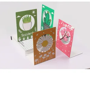 Metal bookends detail view showing cute plant and flower designs for desktop organization.