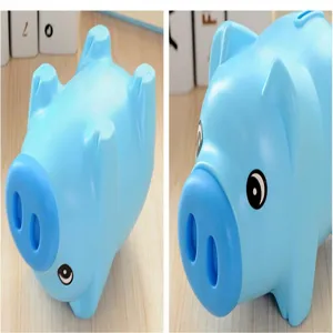 Cute cartoon blue plastic piggy bank coin saving box for children bedroom decor.