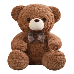 Cute sitting teddy bear plush toy with plaid bow tie, soft stuffed animal for kids hugging sleep.