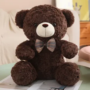Dark brown teddy bear plush toy with bow tie, cute sitting doll, soft hugging pillow variant.