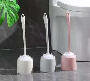 Detailed view of plastic toilet brush set with holder, colorful cleaning tools for bathroom.