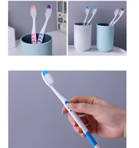 Close-up detail of soft bristle toothbrush with ergonomic non-slip handle for daily oral care.