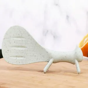 Cute squirrel non-stick rice spoon made of wheat straw with standing base for home use.