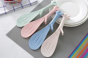 Detail view of four-color wheat straw squirrel rice spoons, non-stick standing kitchen tool.