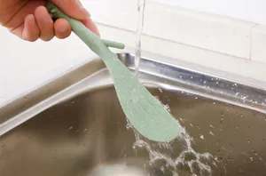 Eco-friendly cute squirrel rice spoon wheat straw non-stick kitchen spatula detail view.