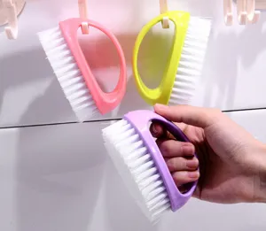 Colorful egg-shaped shoe brush multi-functional laundry cleaning tool for shoes and clothes.