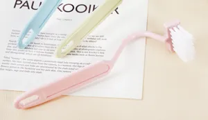 S-shaped toilet cleaning brush with long handle and soft plastic bristles for bathroom.