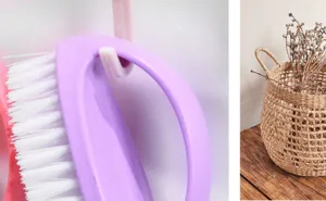 Multi-functional egg-shaped cleaning brush, purple handle with dense white bristles.