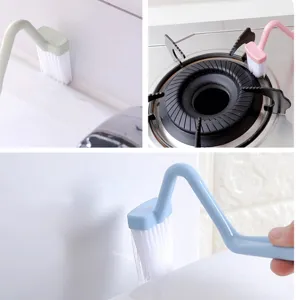 Detailed view of long handle cleaning brush showing gap and stove cleaning usage.