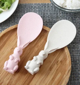 Cute rabbit non-stick rice paddle detail view, standing plastic rice spoon for kitchen cooking.