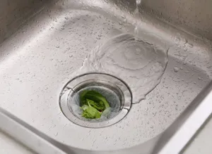 Detailed view of kitchen sink strainer mesh bag filtering vegetable food waste easily.