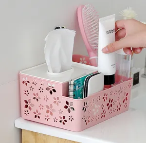 Primer plano detallado de la caja de pañuelos de escritorio multifuncional de color rosa.