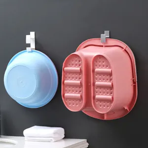 Wandmontierte Kunststoff-Waschbecken und Fußbadewanne für Badezimmer-Organisation und den Heimgebrauch.