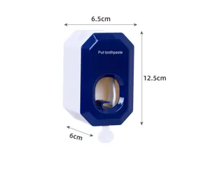 Detail view of the wall-mounted automatic toothpaste dispenser showing dimensions and features.