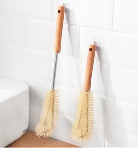Long wooden handle cup brush detail view showing nylon bristles and hanging design.