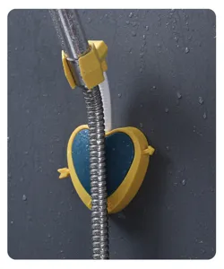 Close-up detail of cute heart-shaped shower head holder in yellow and blue, bathroom accessory.