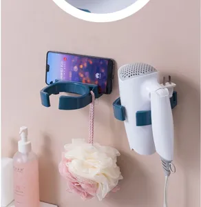 Bathroom wall mounted hair dryer holder and phone rack detail view, convenient storage organizer.