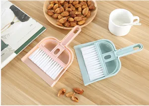 Mini desktop broom and dustpan set for cleaning keyboards and tables, compact and practical.