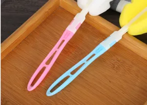 Detailed close-up showing foldable sponge cup and bottle cleaning brush with plastic handle.