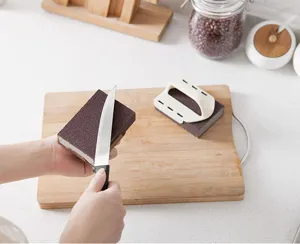 Carborundum sponge magic eraser with handle for cleaning pot bottom and kitchen rust removal.