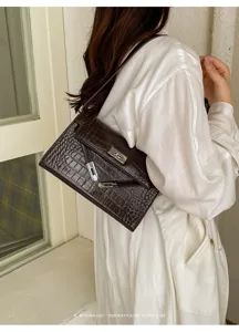 Dark brown crocodile embossed leather shoulder bag, minimalist retro style for women detail view.