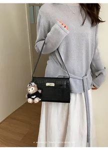 Crocodile pattern women shoulder bag with cute bear charm, stylish minimalist daily handbag.