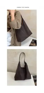 Dettaglio borsa a spalla intrecciata marrone, grande capacità, elegante lavorazione.