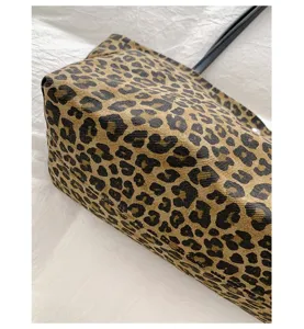 Close up view of the stylish leopard print canvas tote bag detail, featuring textured print.