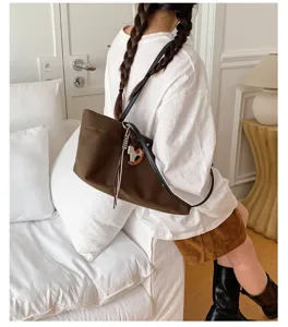 Detailed view of the stylish brown canvas shoulder tote bag, ideal for daily commute and casual.