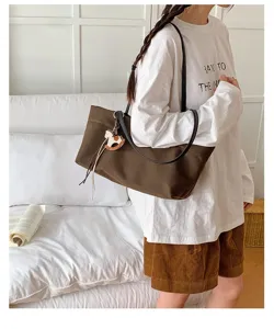 Casual brown canvas tote bag for women, large capacity shoulder bag for daily commute and school.