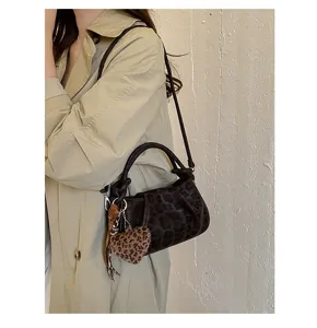 Retro pleated leopard print cloud handbag with fuzzy heart charm, chic crossbody shoulder bag.