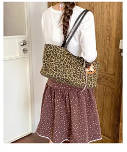 Stylish leopard print tote bag for women, large capacity shoulder bag for daily commute and school.