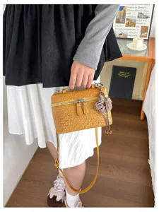 Retro woven vanity shoulder bag for women, chic brown square crossbody bag with flower charm.