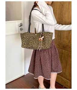 Leopard print tote bag detail view, casual shoulder bag with cute horse charm for daily use.