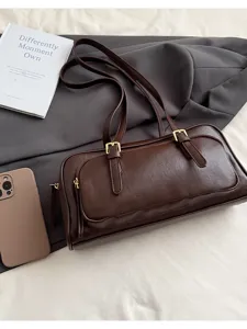 Vintage brown shoulder underarm bag with buckle detail and front pocket, stylish daily wear.